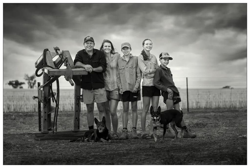 Family Bonds in Black and White: A Portrait of Love on the Farm