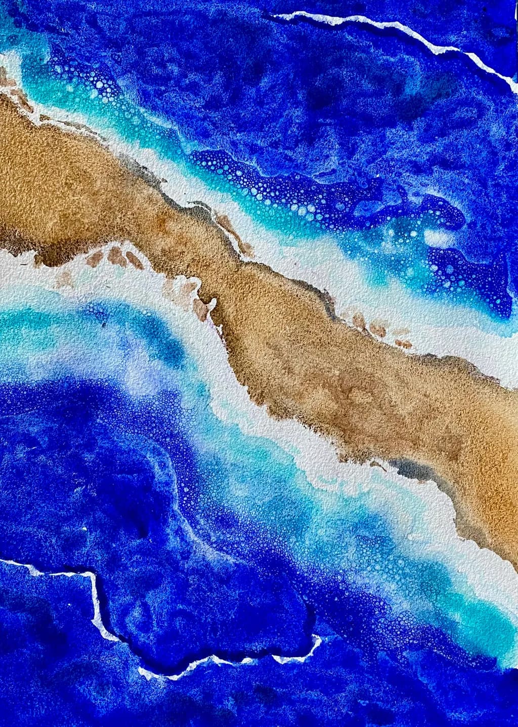 Ocean's Embrace: A Serene Dance of Blues and Sands