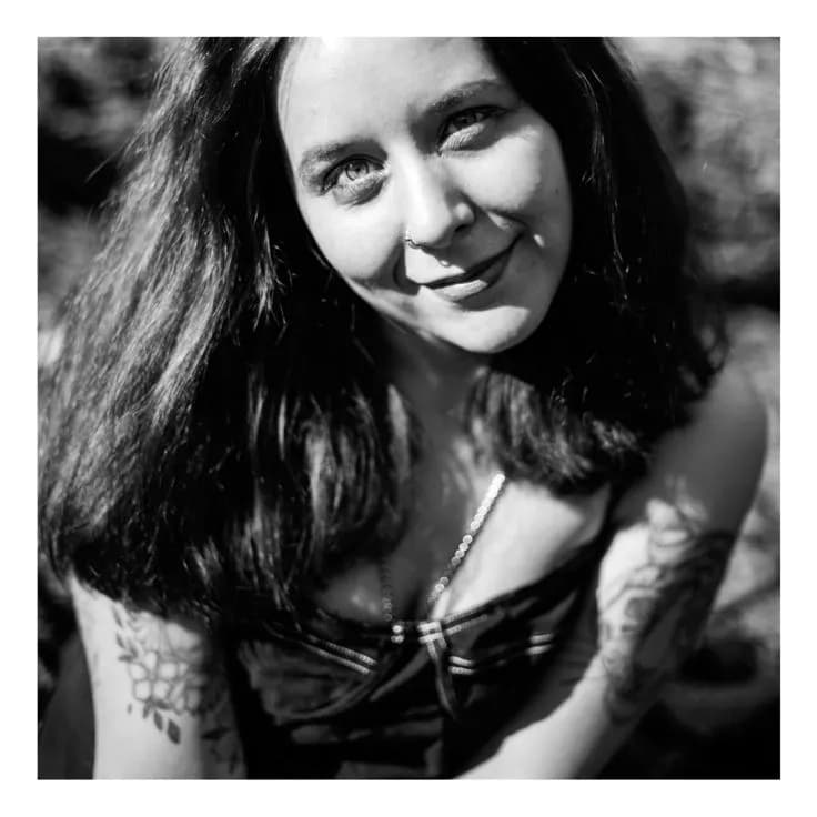Whispers of Ink and Light: A Portrait of Bold Beauty in Black and White