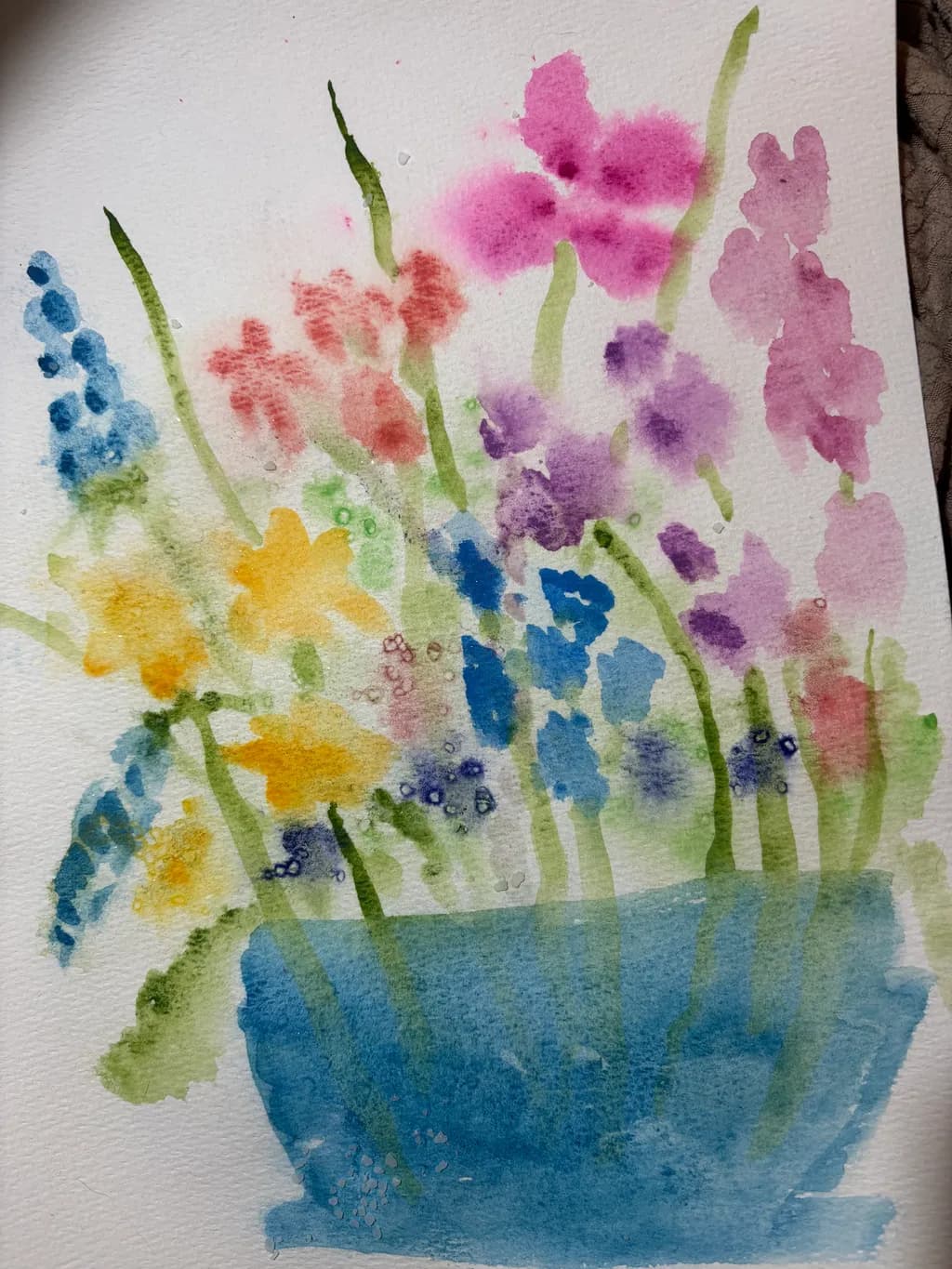 Vibrant Watercolor Blooms: A Symphony of Colorful Flowers in a Blue Pot