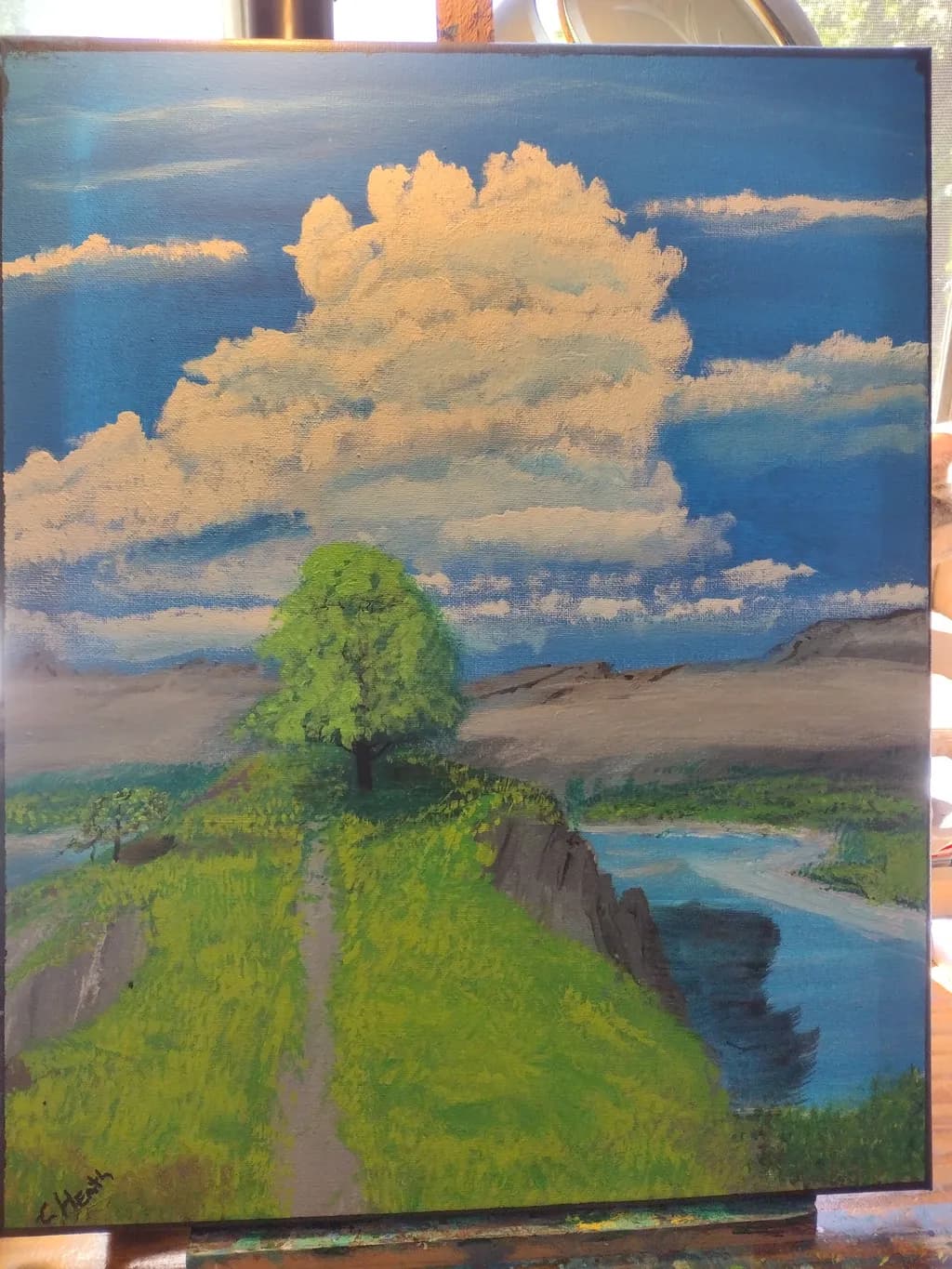 Serenity by the River: A Tranquil Landscape of Pathways and Clouds