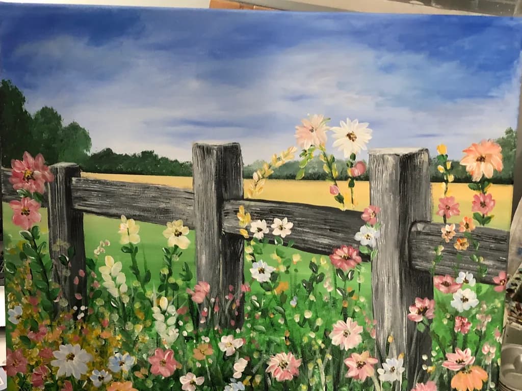 Whispers of Spring: A Serene Floral Landscape by the Rustic Fence