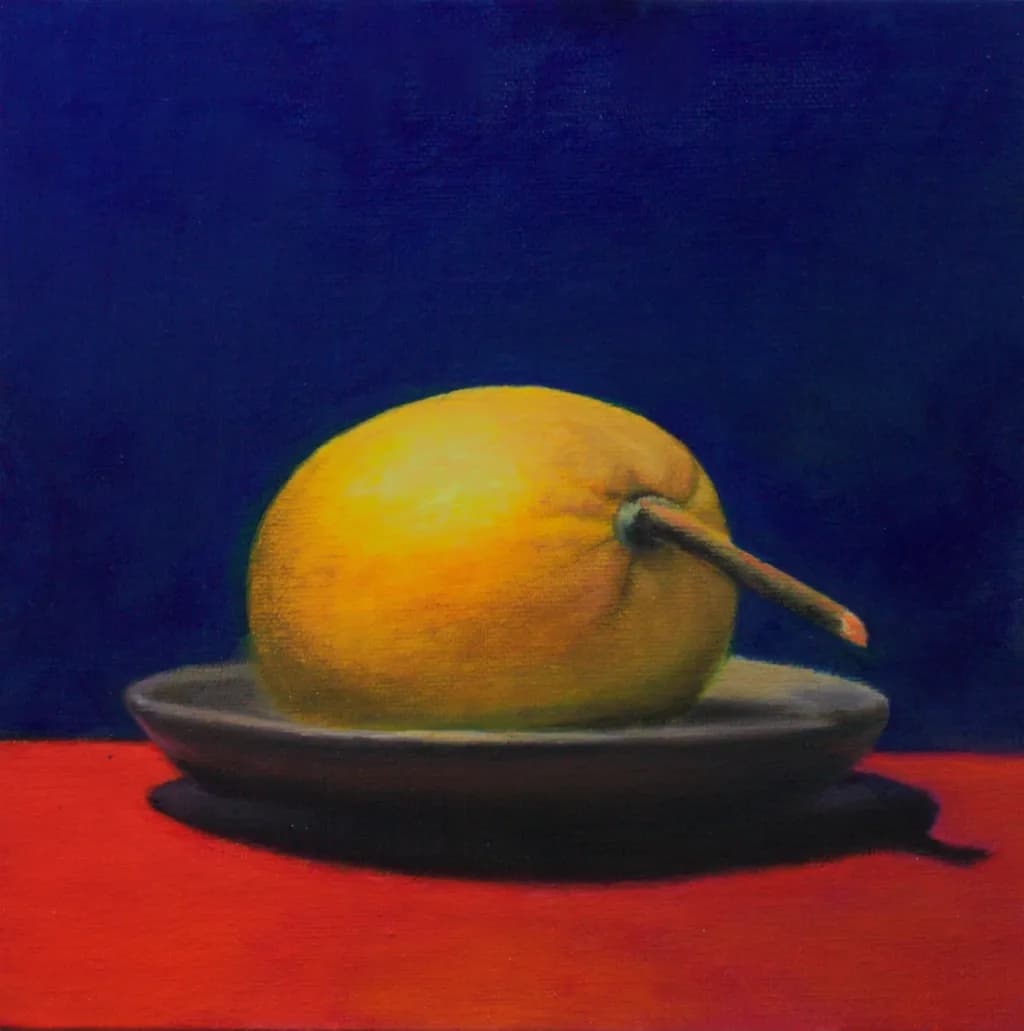 Golden Harmony: A Still Life of a Yellow Pear on a Vibrant Plate