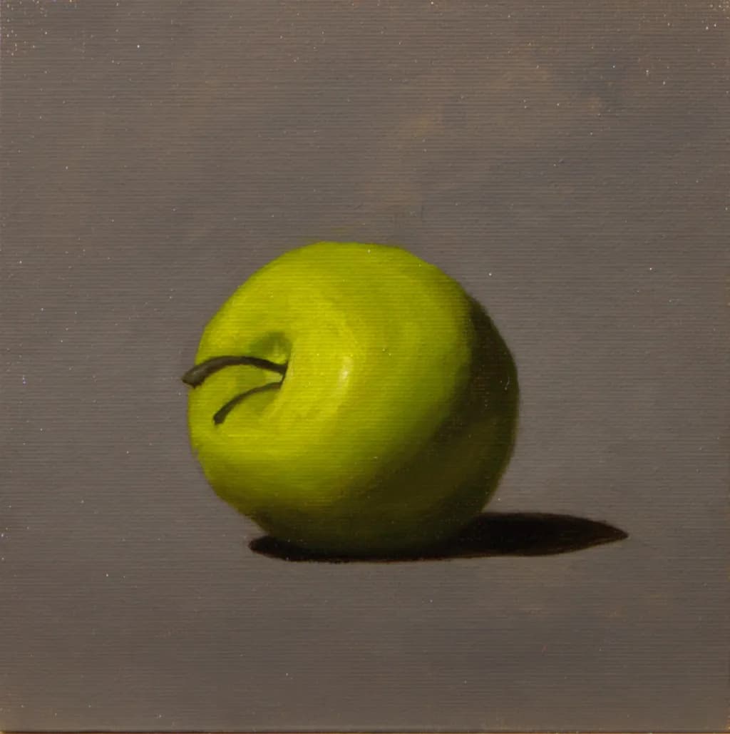 Luminous Green Apple: A Still-Life Exploration of Shadow and Light