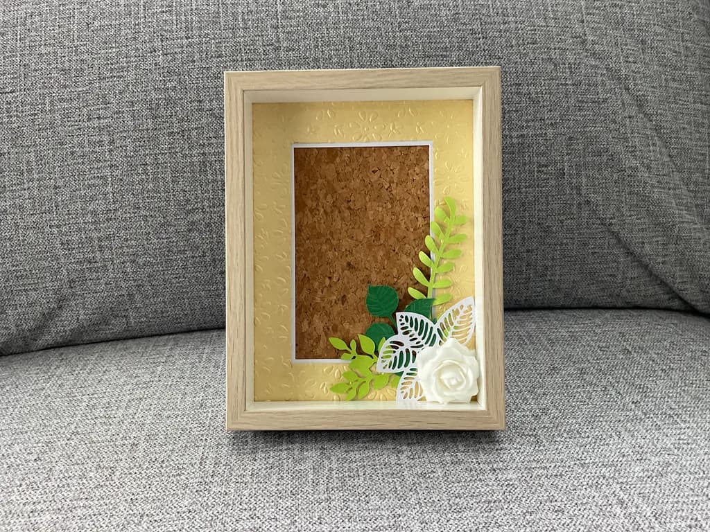 Whispers of Nature: Elegant Floral Frame with Cork Background