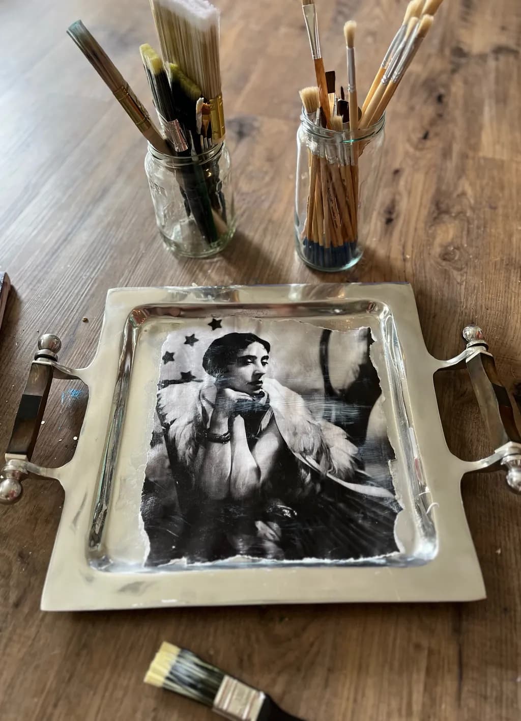 Whispers of Elegance: A Vintage Portrait on Silver Tray