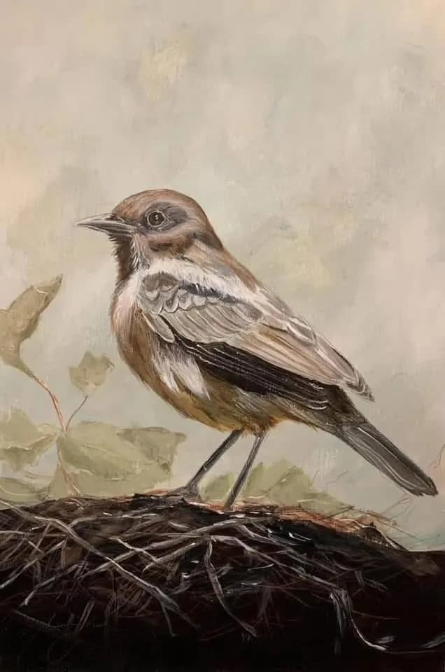 Whispers of Nature: A Serene Bird Perched Amongst the Leaves