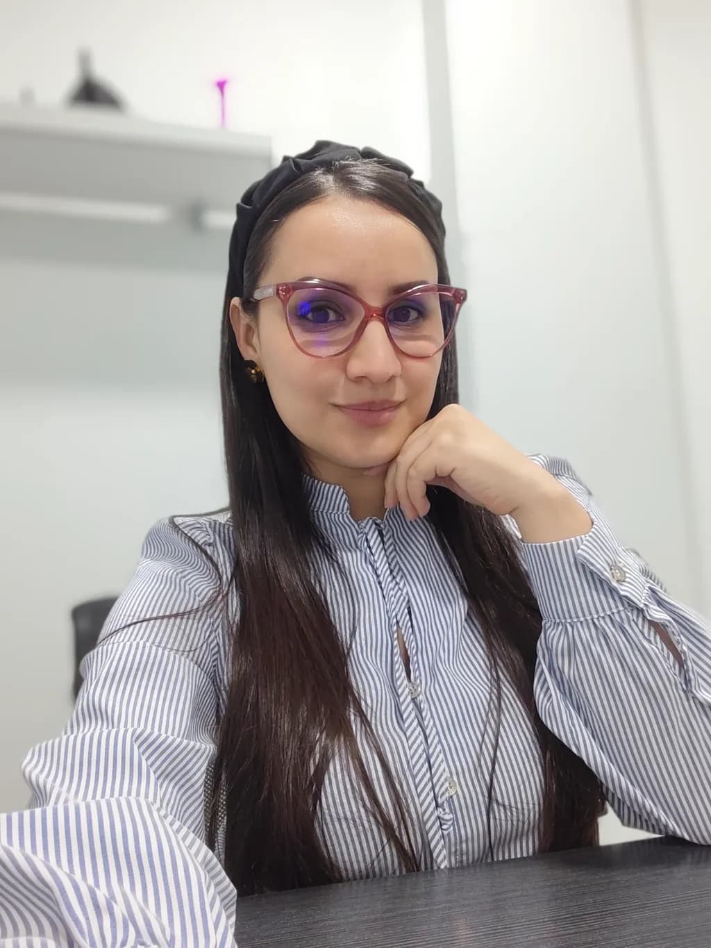 Elegant Confidence: A Portrait of Modern Professionalism in Stripes and Style
