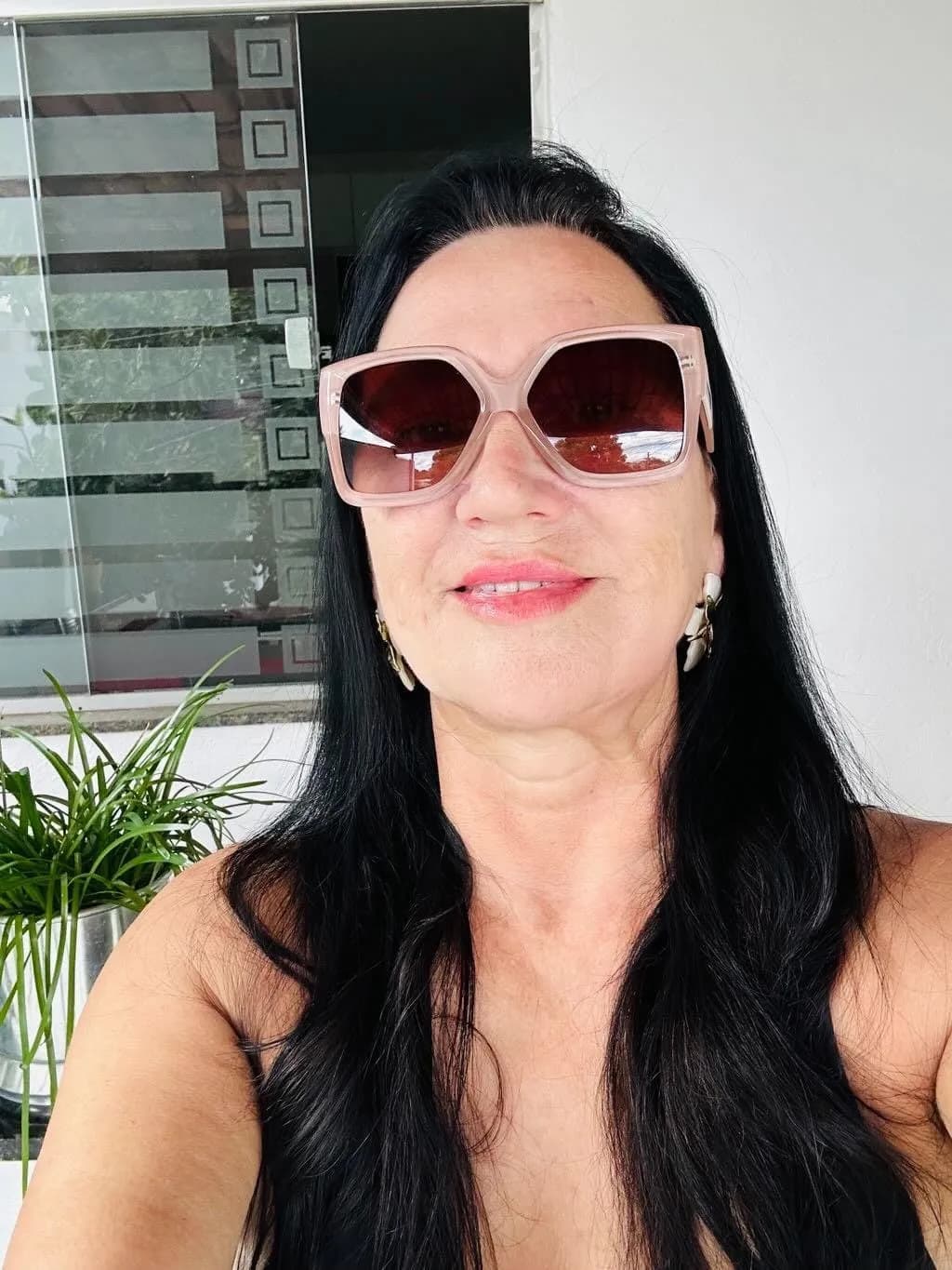 Radiant Elegance: A Portrait of Confidence and Style in Sunglasses