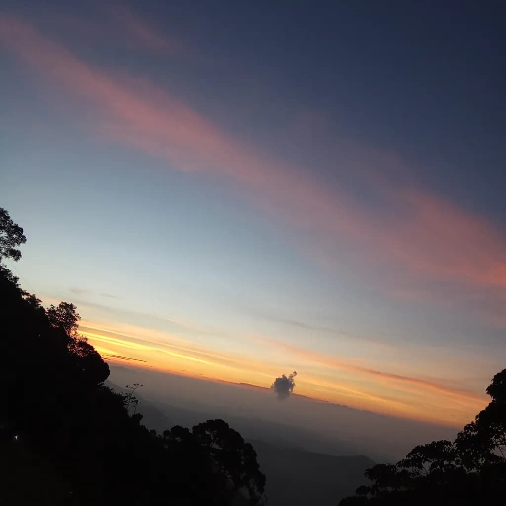 Whispers of Dusk: A Serene Sunset Over the Mountains