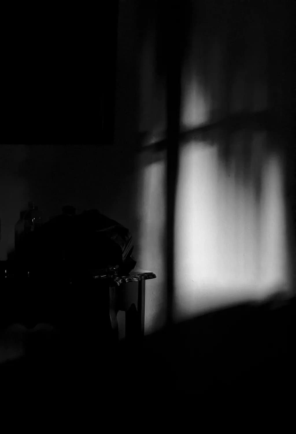 Whispers of Light: A Monochrome Dance of Shadows and Texture in Interior Spaces