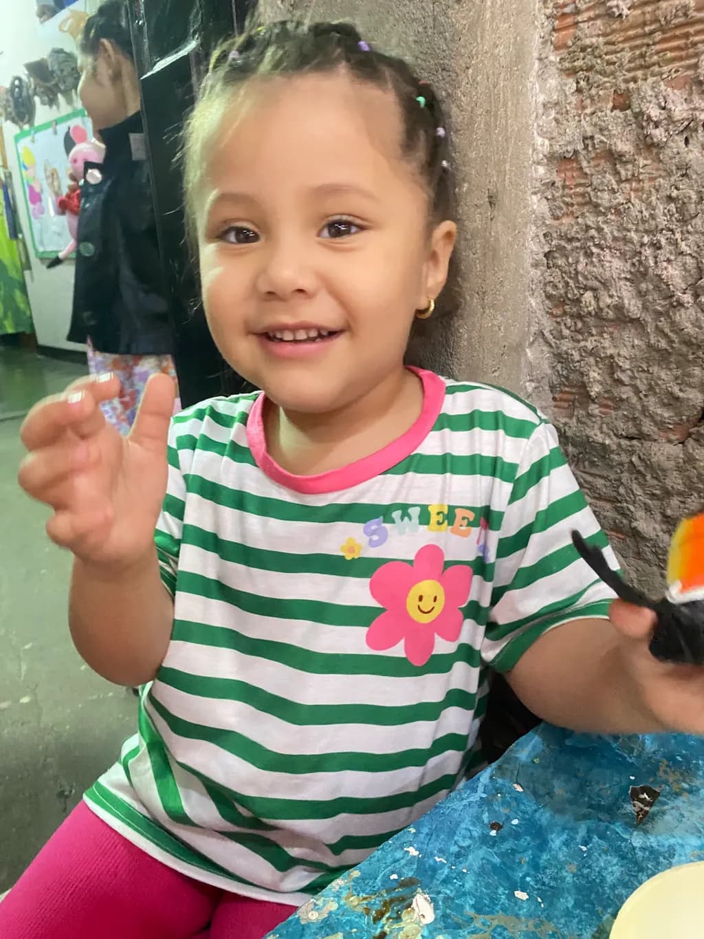 Joyful Moments: A Young Artist's Delight in Colorful Creativity