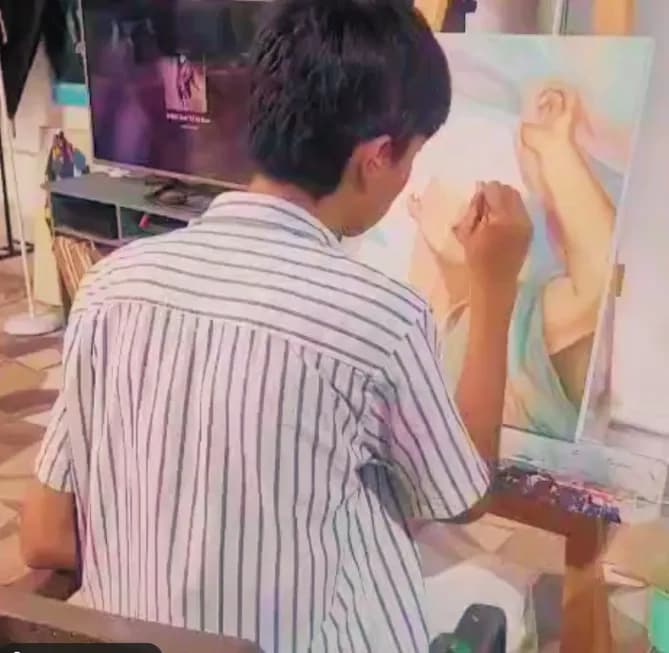 Creative Journey: A Young Artist at Work in Vibrant Colors
