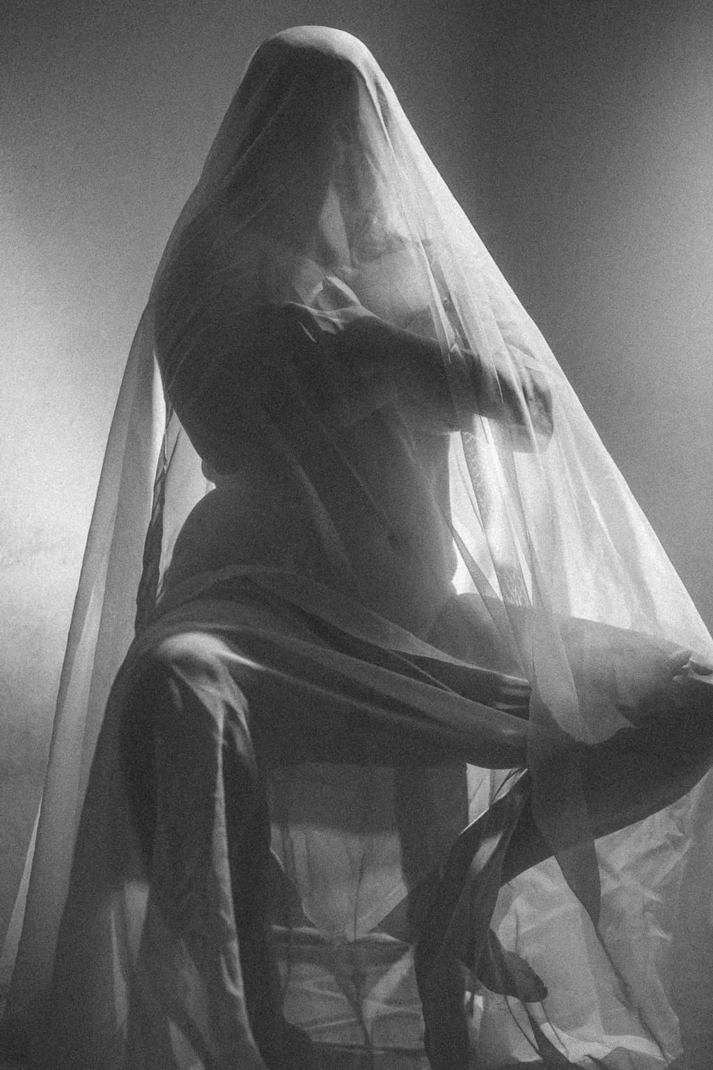 Veiled Emotions: A Dance of Light and Shadow in Intimate Form