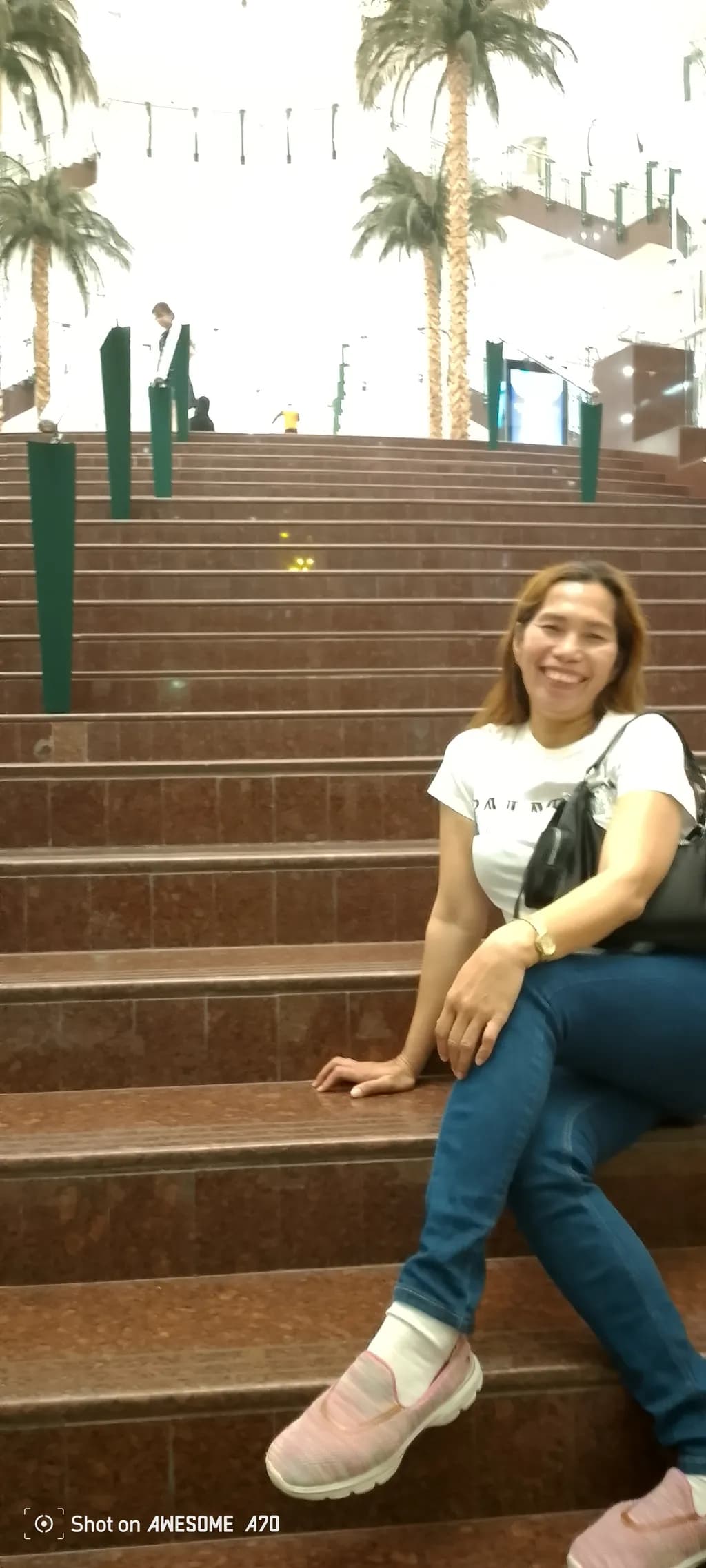 Joyful Moments on the Steps: A Serene Encounter in a Luminous Space