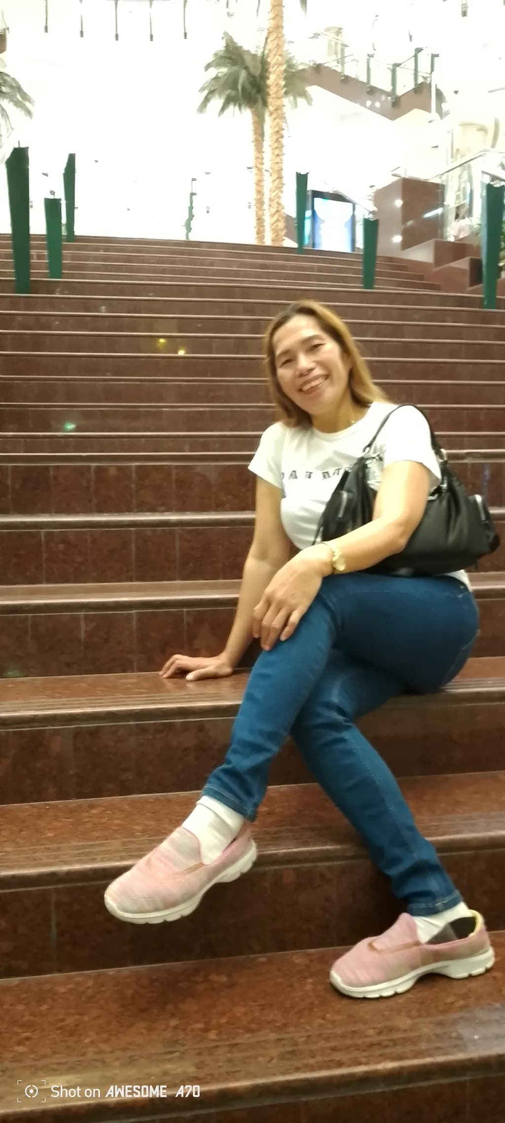 Casual Elegance: A Relaxed Moment on the Steps