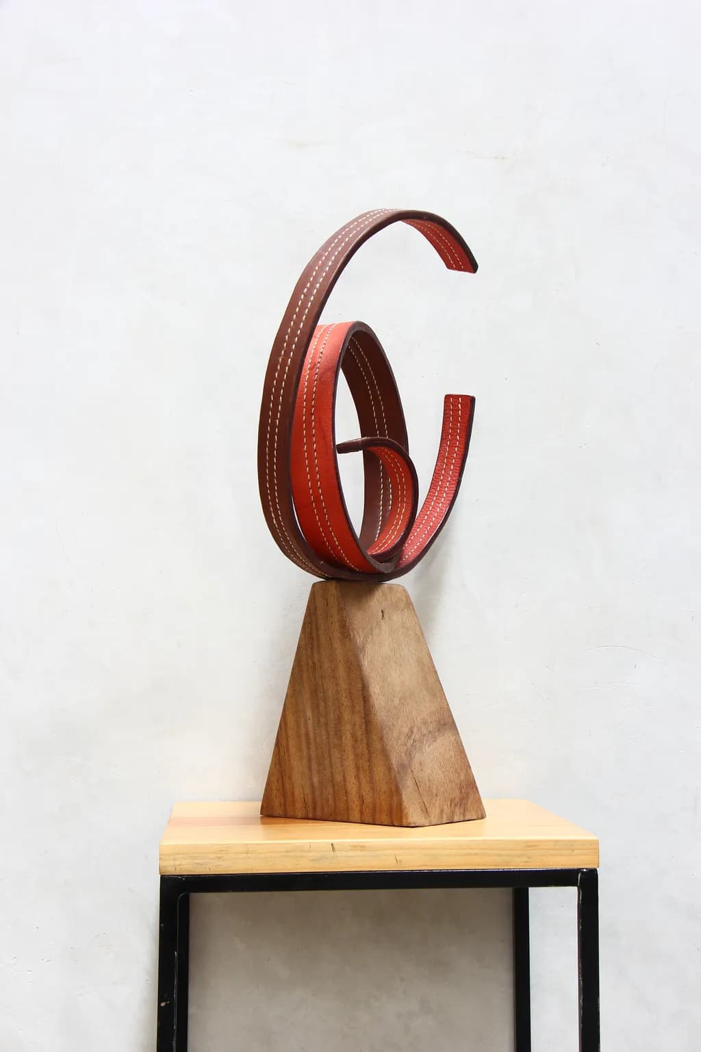 Whimsical Harmony: A Sculptural Dance of Leather and Wood