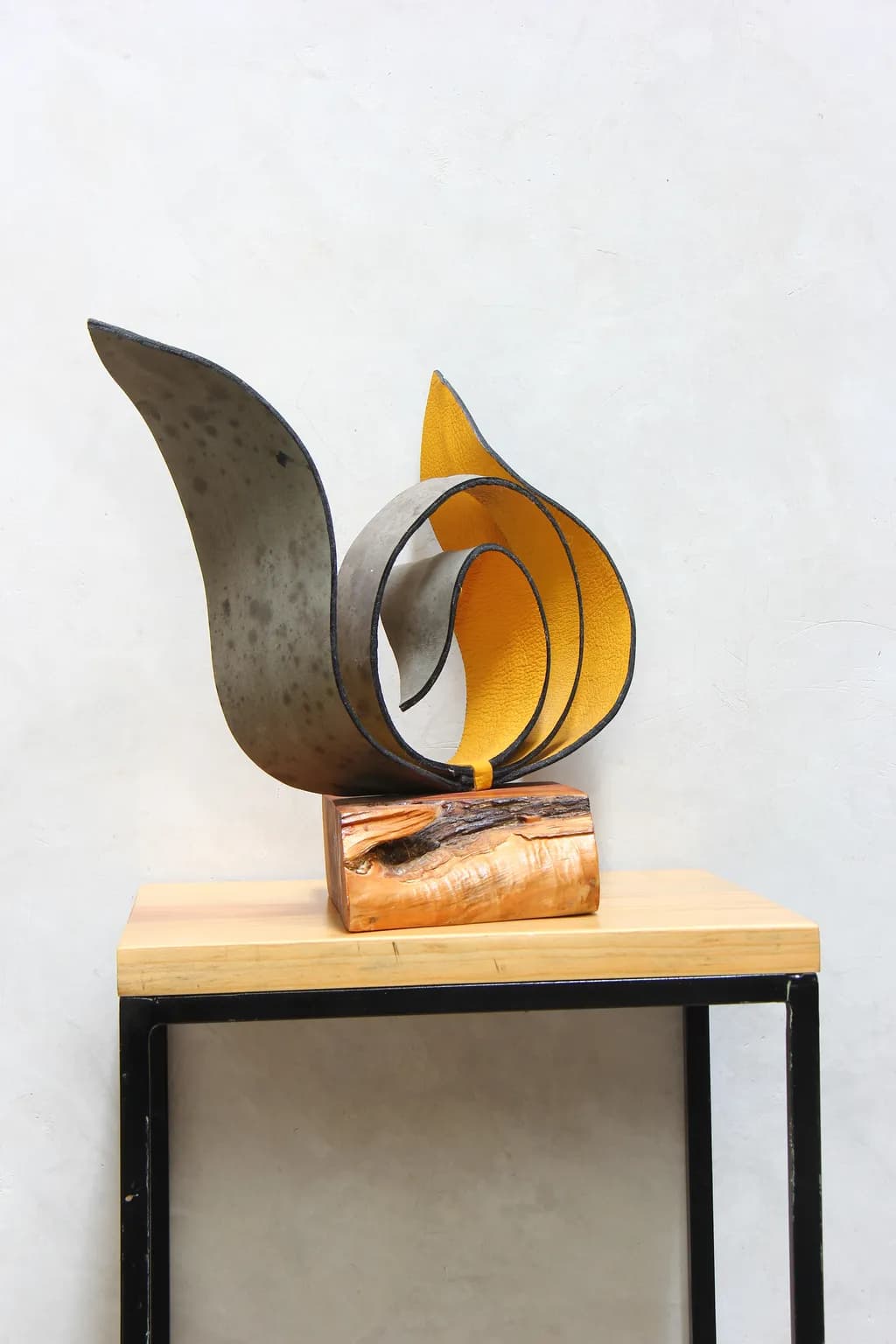 Whispers of Metal and Wood: A Dynamic Sculpture of Flowing Forms