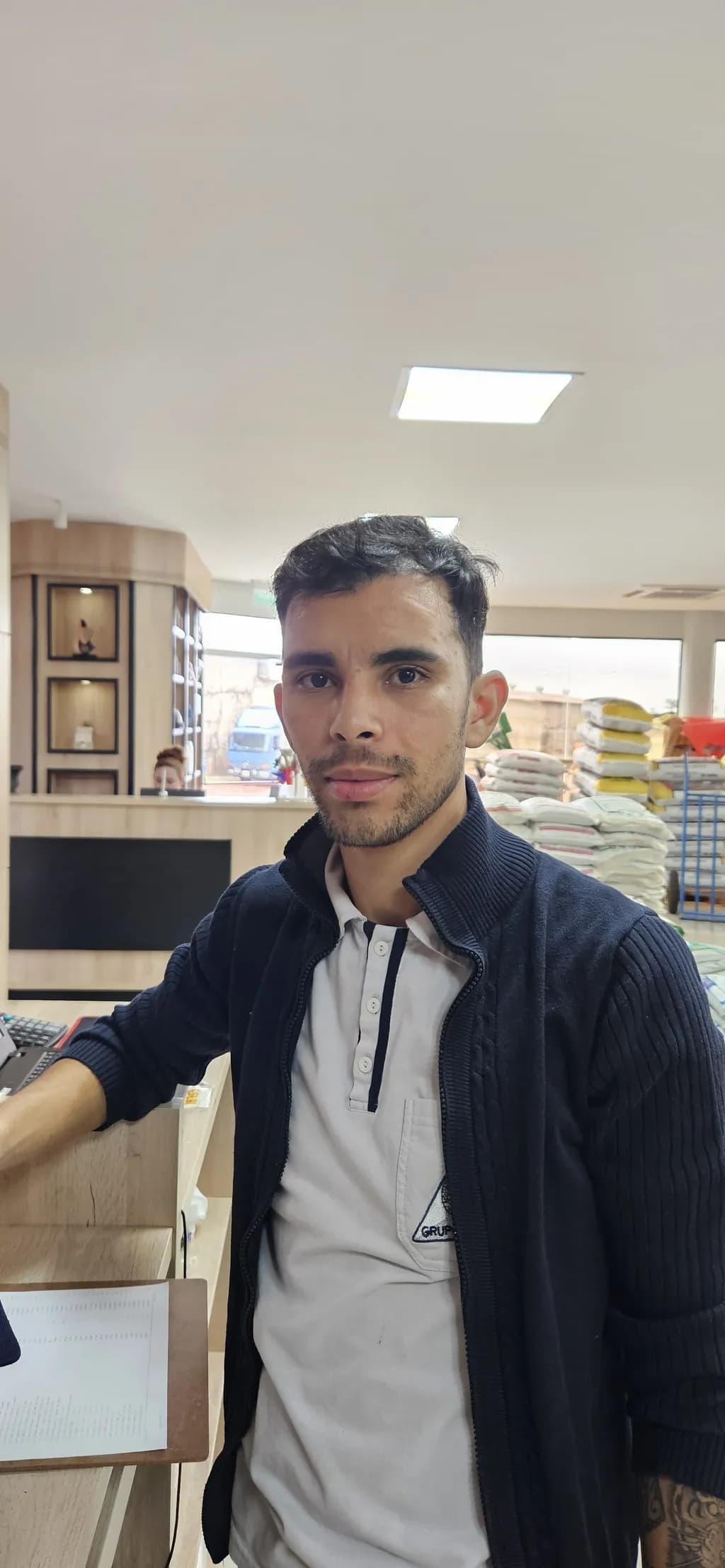 Portrait of Determination: A Glimpse into Everyday Life Behind the Counter
