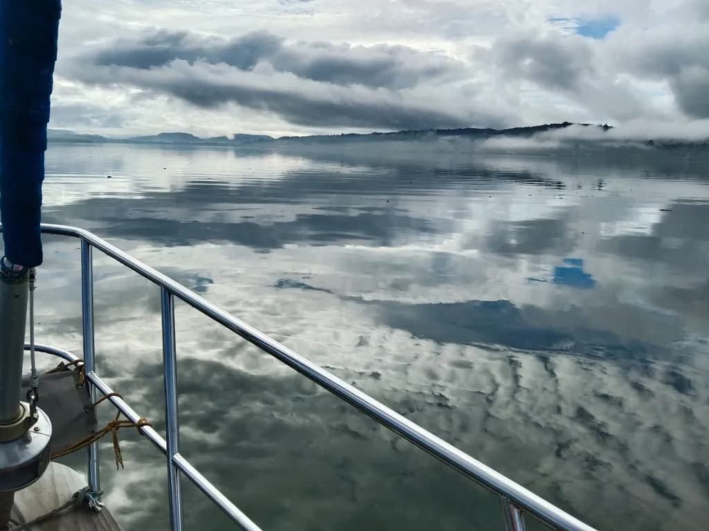 Serenity on the Water: A Tranquil Landscape of Reflections and Clouds
