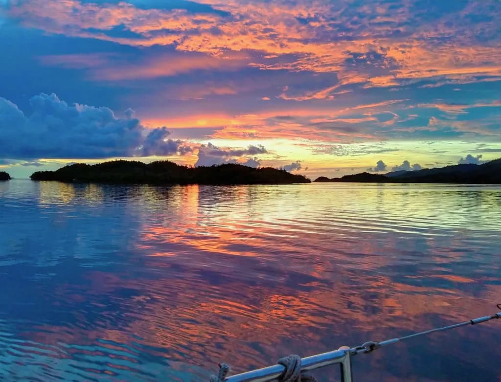 Serenity at Sunset: A Tranquil Reflection Over Water and Islands