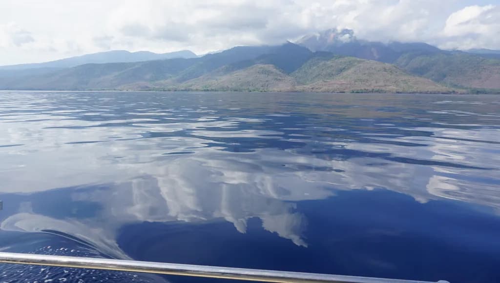 Whispers of Serenity: A Tranquil Reflection on Water and Mountains