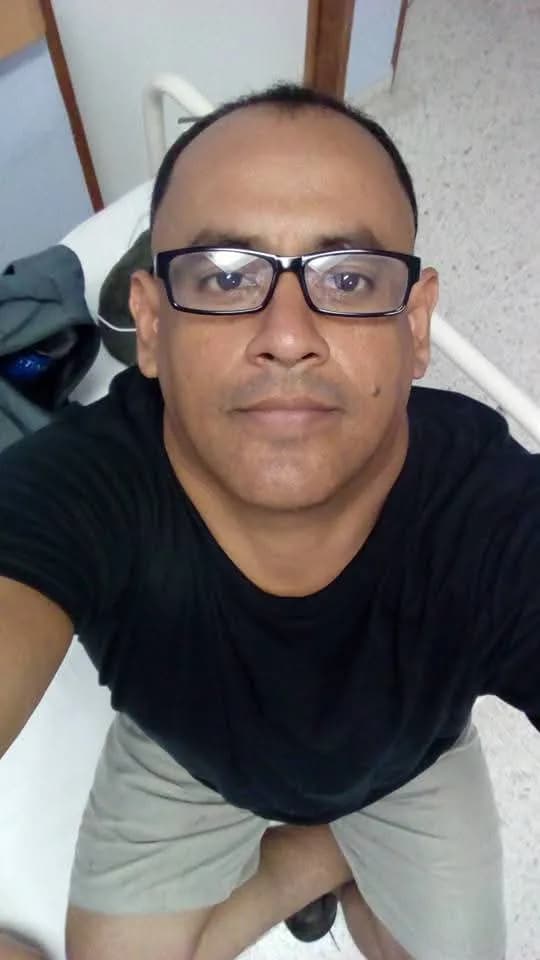 Casual Reflections: A Relaxed Indoor Self-Portrait in Glasses