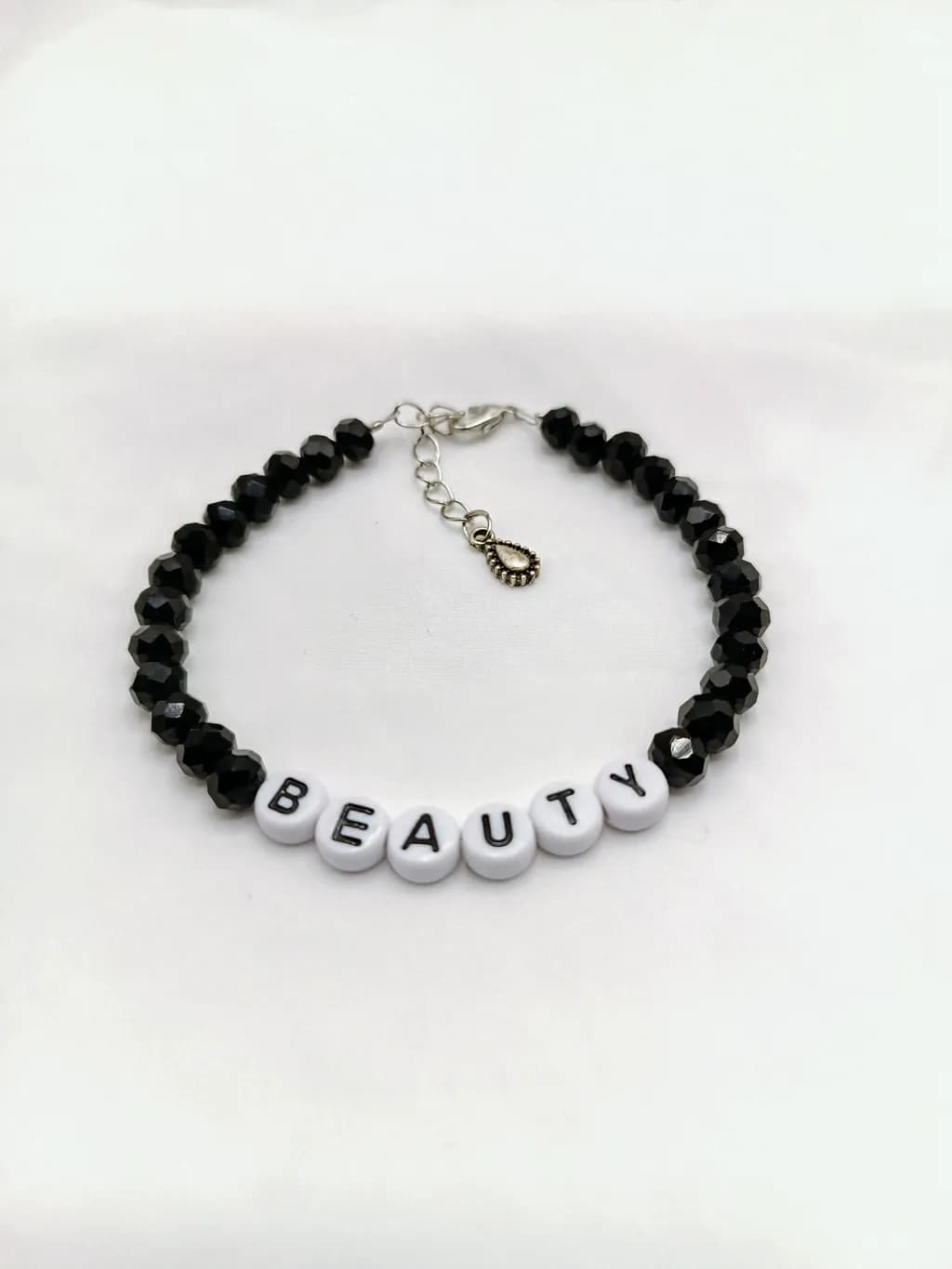 black glass bead bracelet with beauty letters