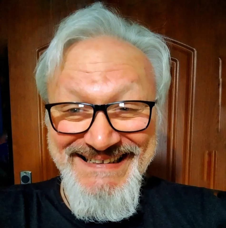 Joyful Reflections: A Grinning Portrait of Wisdom and Warmth