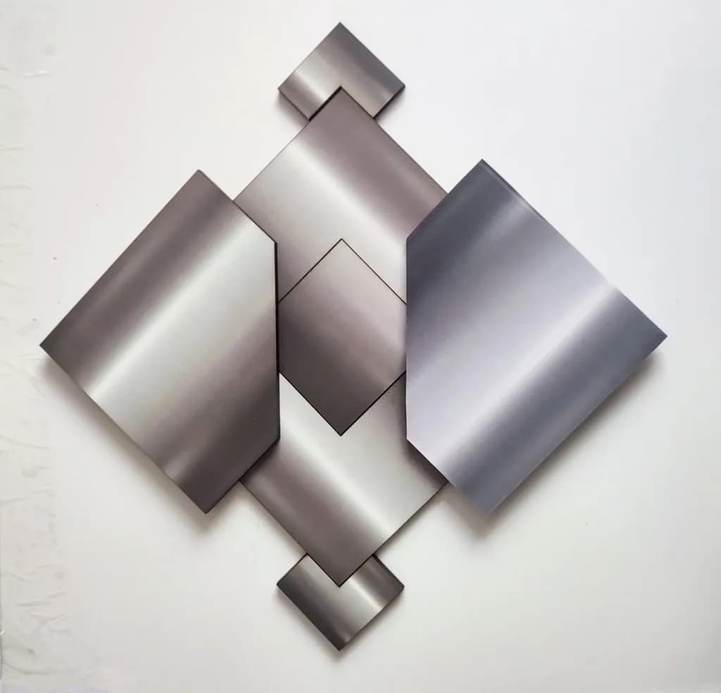 Geometric Harmony: A Dance of Metallic Forms in Silver Tones