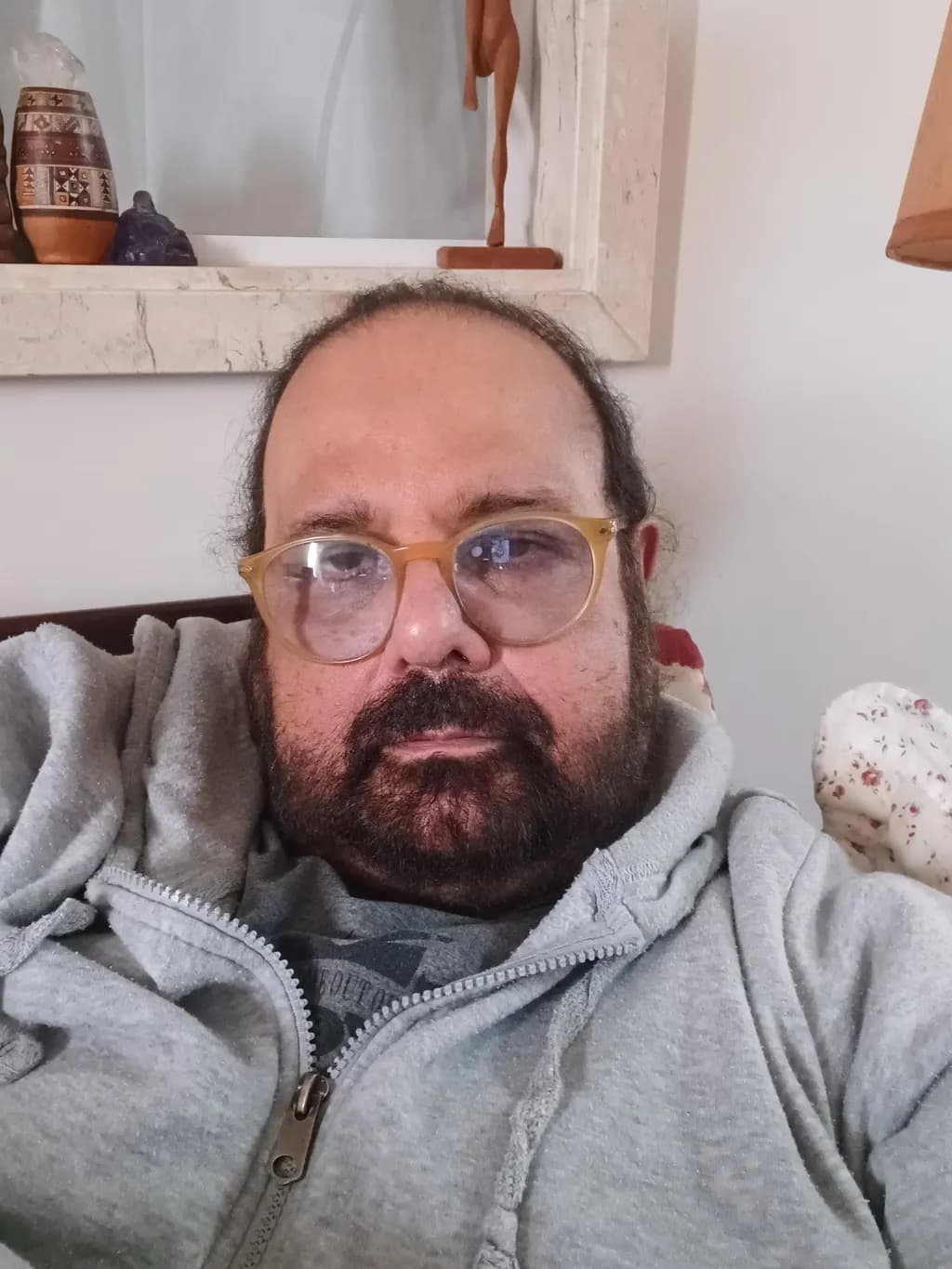 Casual Reflections: A Portrait of Relaxed Introspection in Glasses and Beard