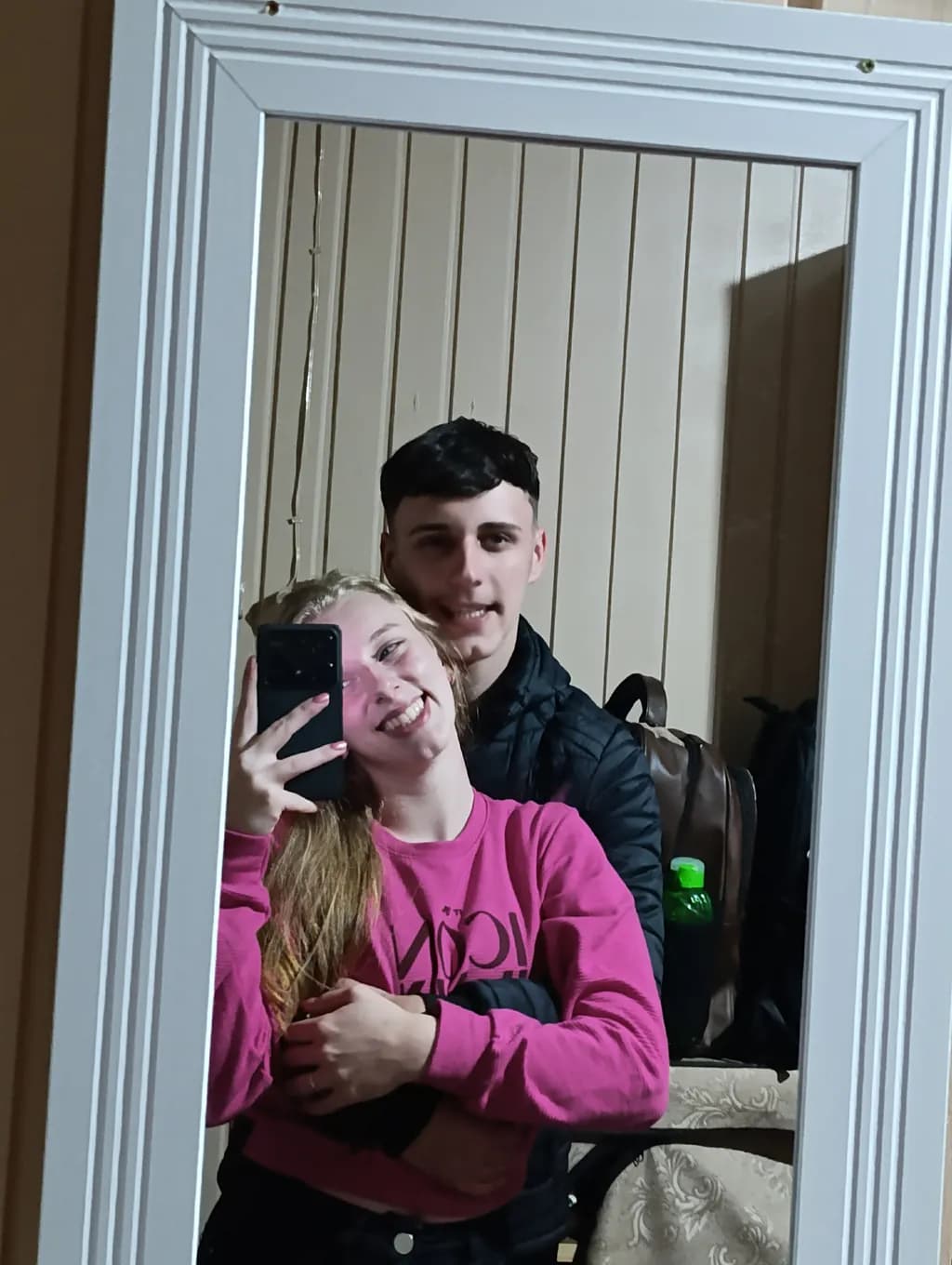 Reflections of Joy: A Mirror Moment Captured in Love