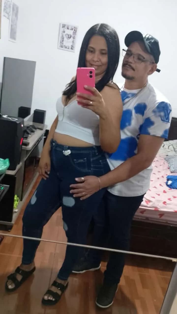Intimate Reflections: A Couple's Selfie in a Cozy Space