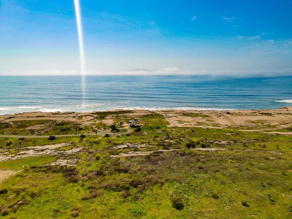 Serenity by the Shore: A Coastal Escape Under Clear Blue Skies