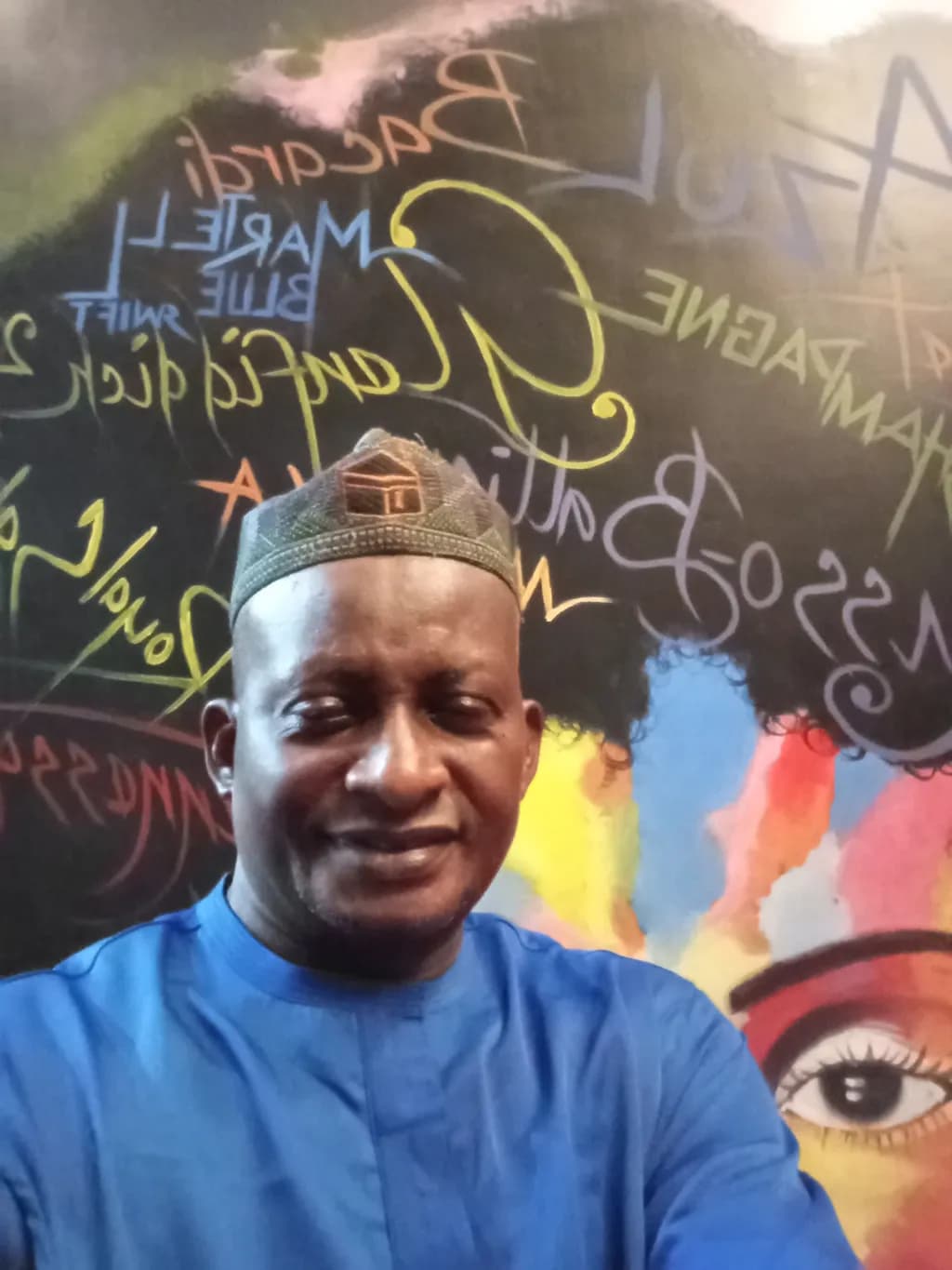Vibrant Expressions: A Portrait Against a Colorful Mural Backdrop