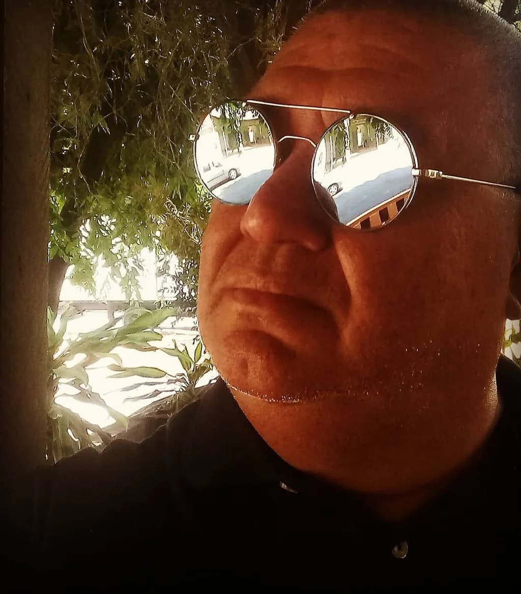 Reflections of a Sunlit Soul: A Portrait in Shades and Serenity