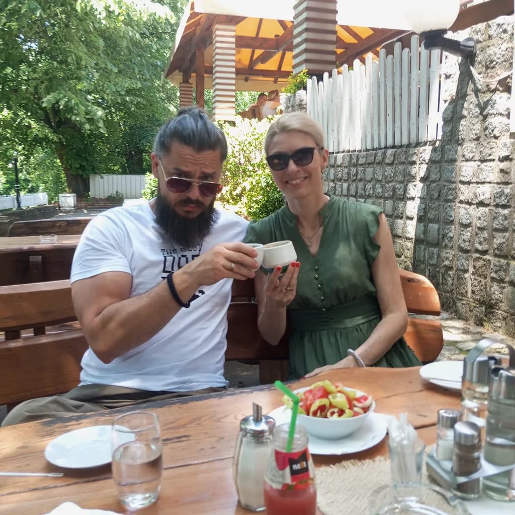 Casual Moments: A Couple's Delight in Outdoor Dining and Refreshing Drinks