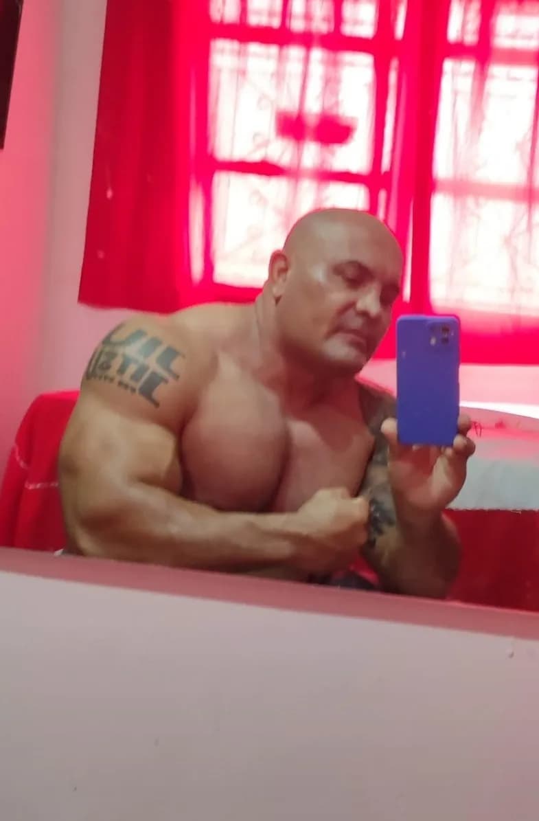 Reflections of Strength: A Bold Self-Portrait in Red Light