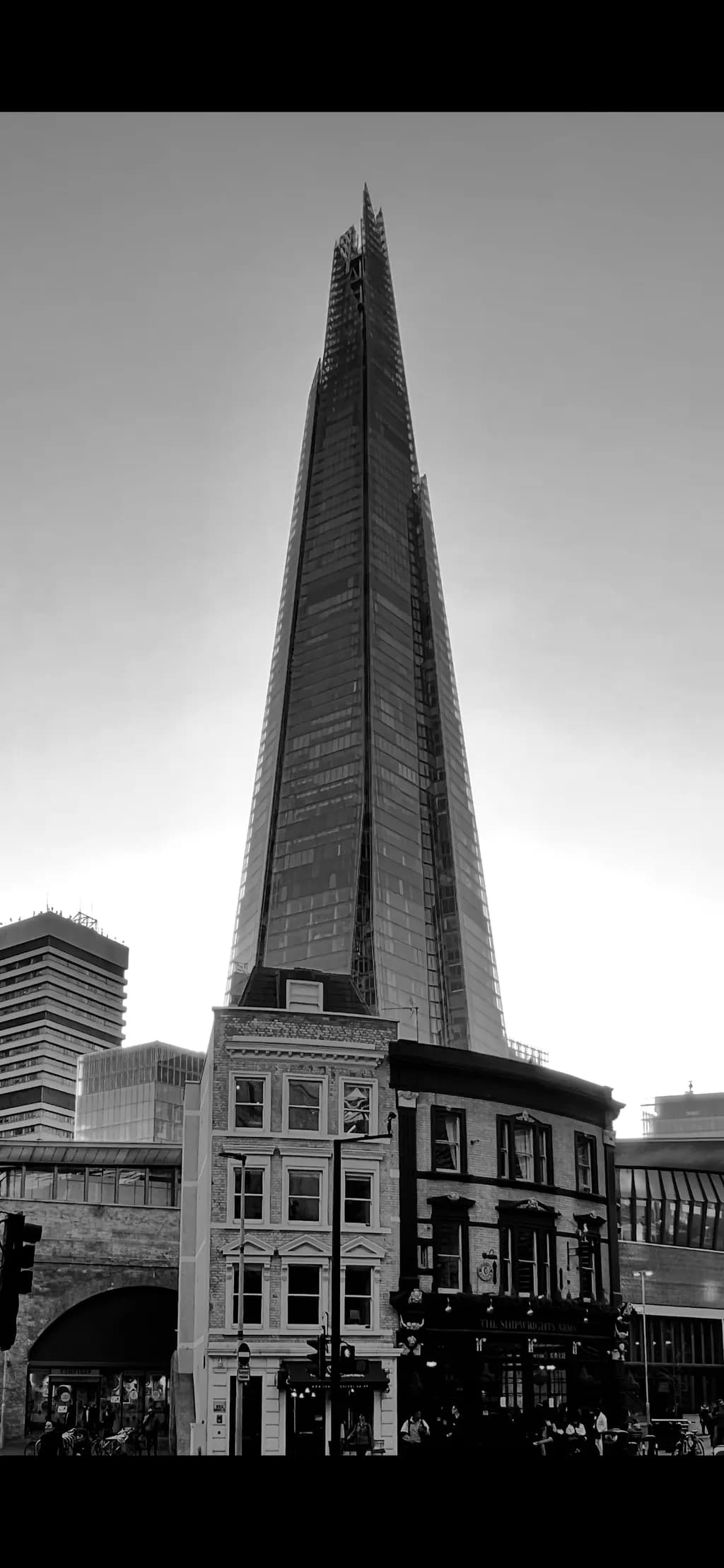 Urban Harmony: The Shard and Historic Facades in Monochrome Elegance