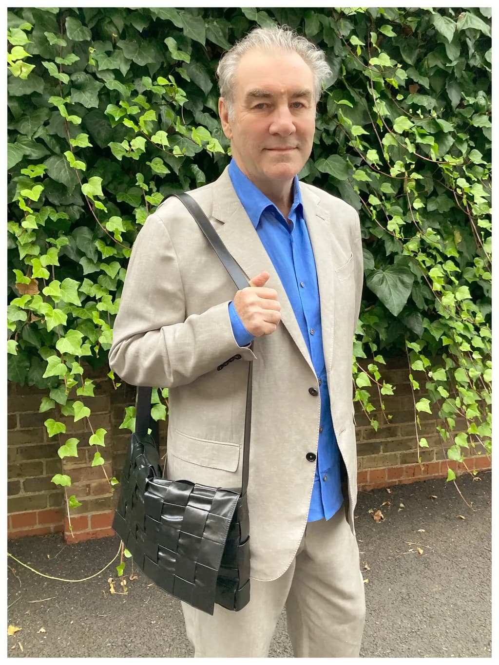 Elegant Portrait in Greenery: A Stylish Accessory for Casual Sophistication