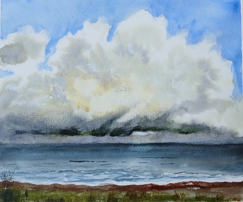 Serenity in Blue: A Tranquil Landscape of Clouds and Water