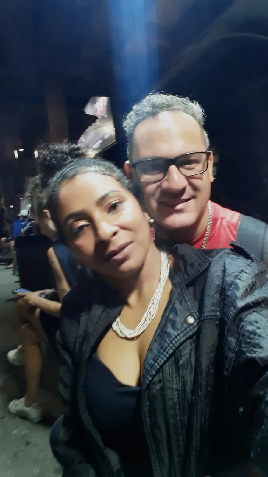 Urban Night Embrace: A Portrait of Love and Style in the City Lights