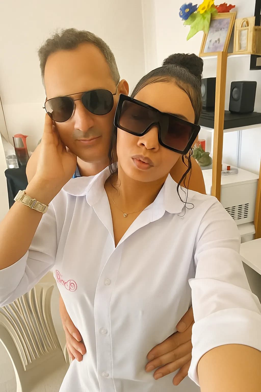 Chic Moments: A Stylish Duo in Sunglasses and Elegance