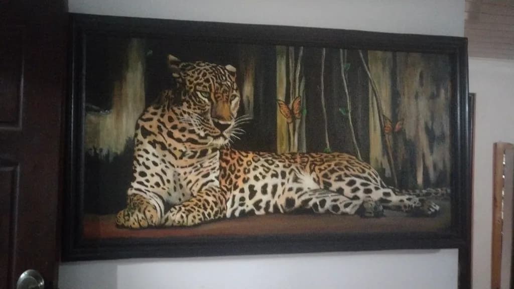 Majestic Serenity: A Jaguar's Rest Amidst Nature's Embrace