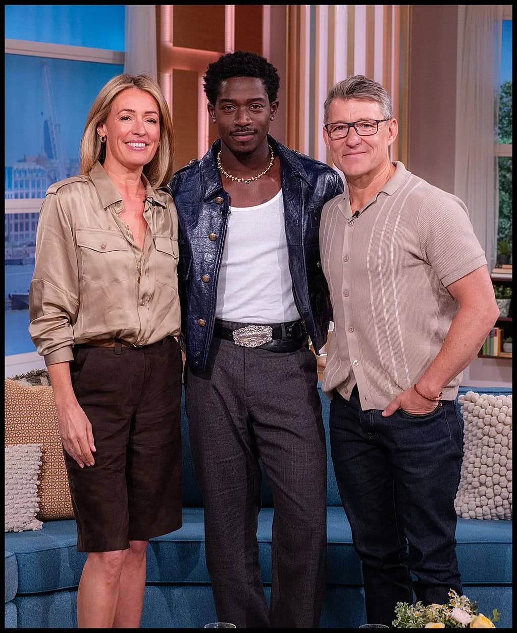 Dynamic Trio: A Moment of Connection and Style on Set