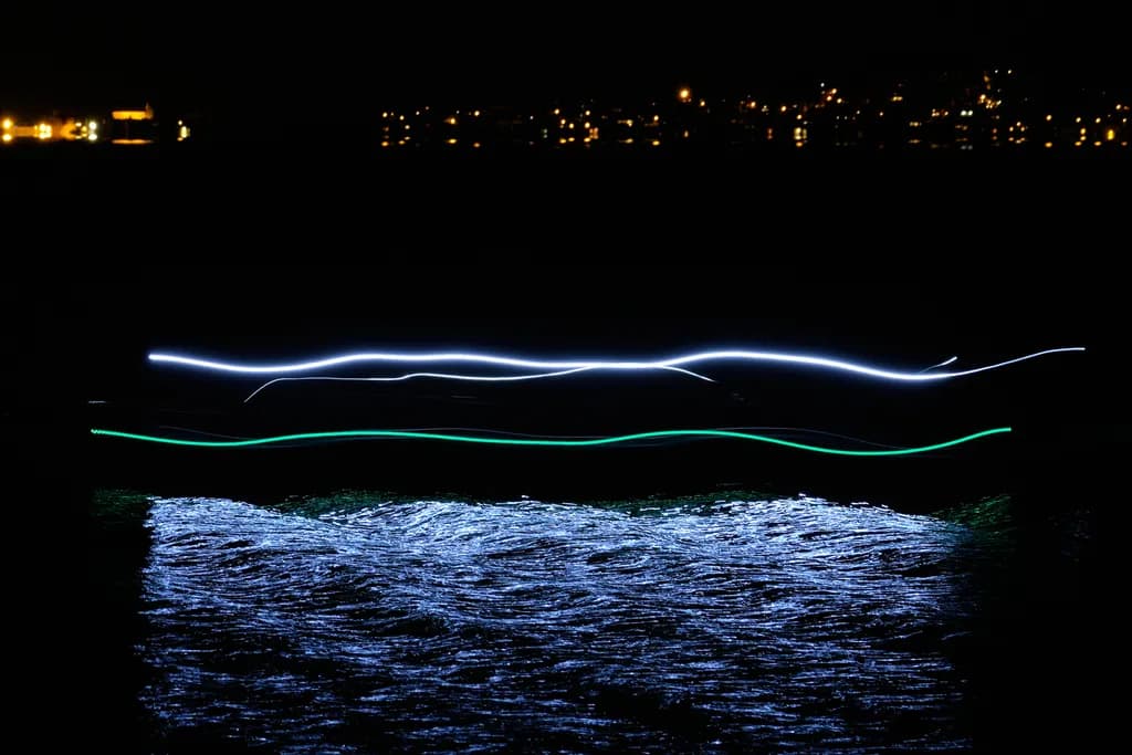 Whispers of Light: A Serene Dance on Water's Surface