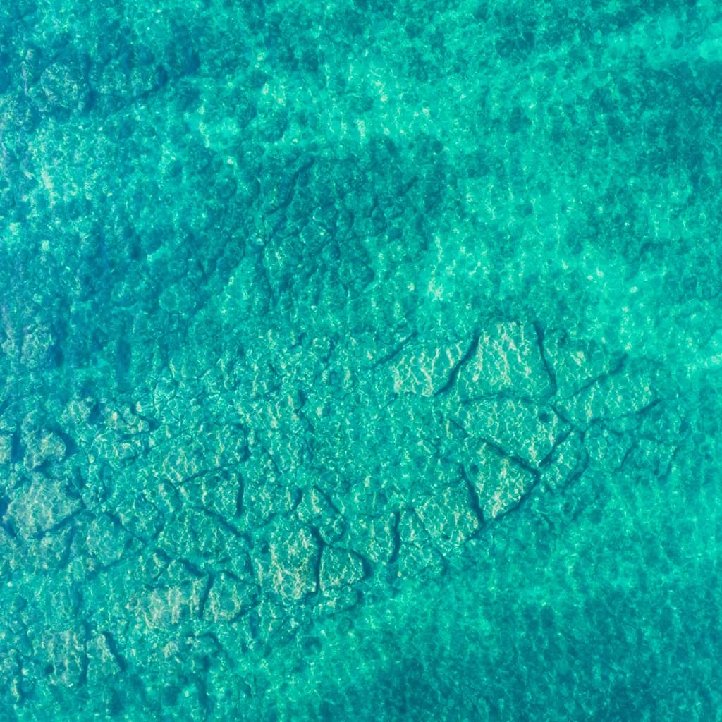 Ocean's Embrace: A Serene Dance of Blue Textures and Patterns in Water