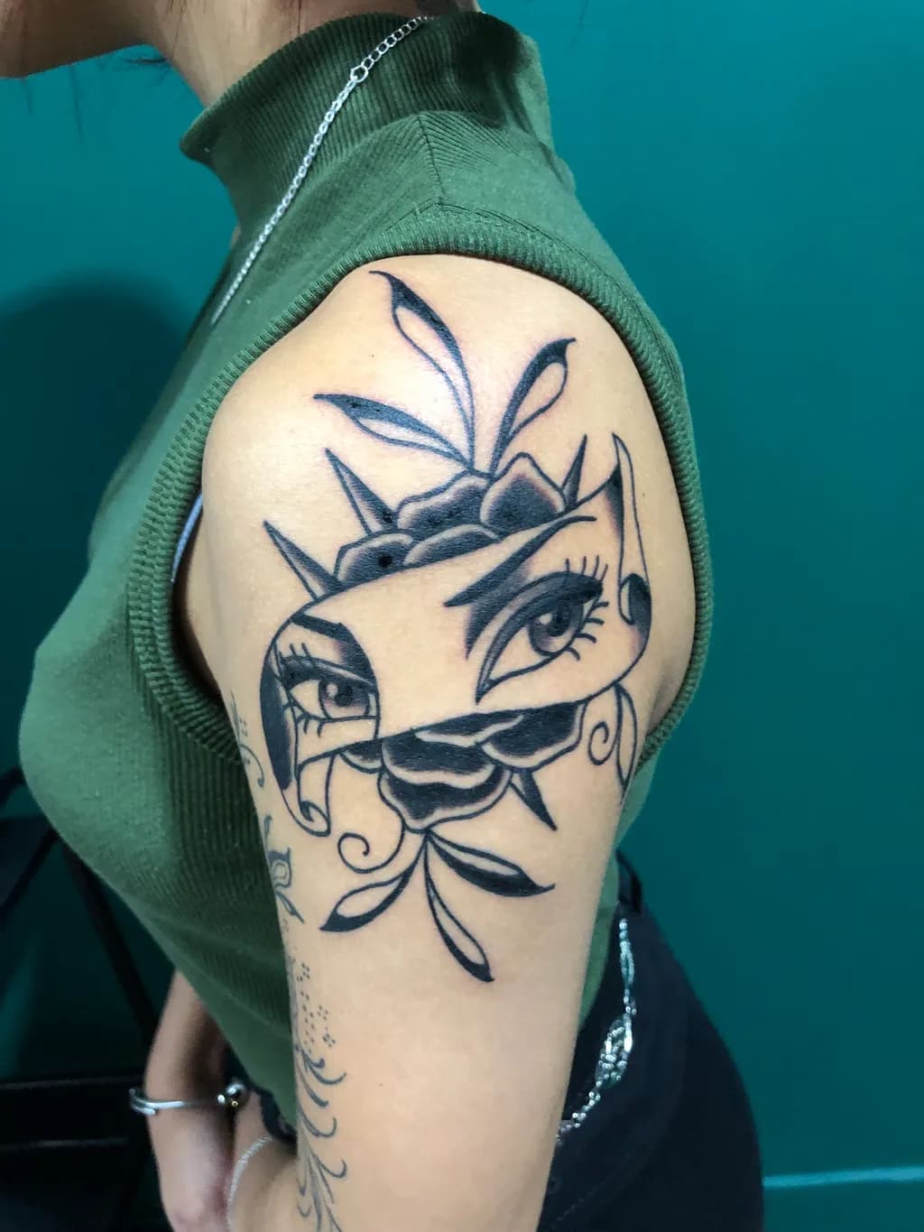 Mystical Eyes and Floral Whispers: A Bold Tattoo Design