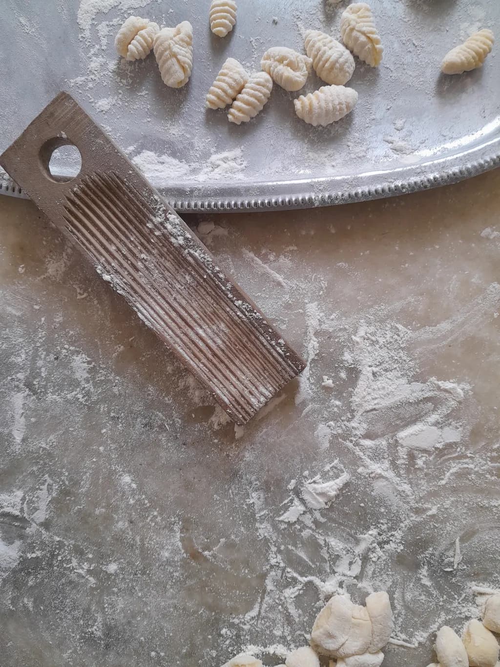 Whispers of Dough: A Rustic Gnocchi Creation on Flour-Dusted Canvas