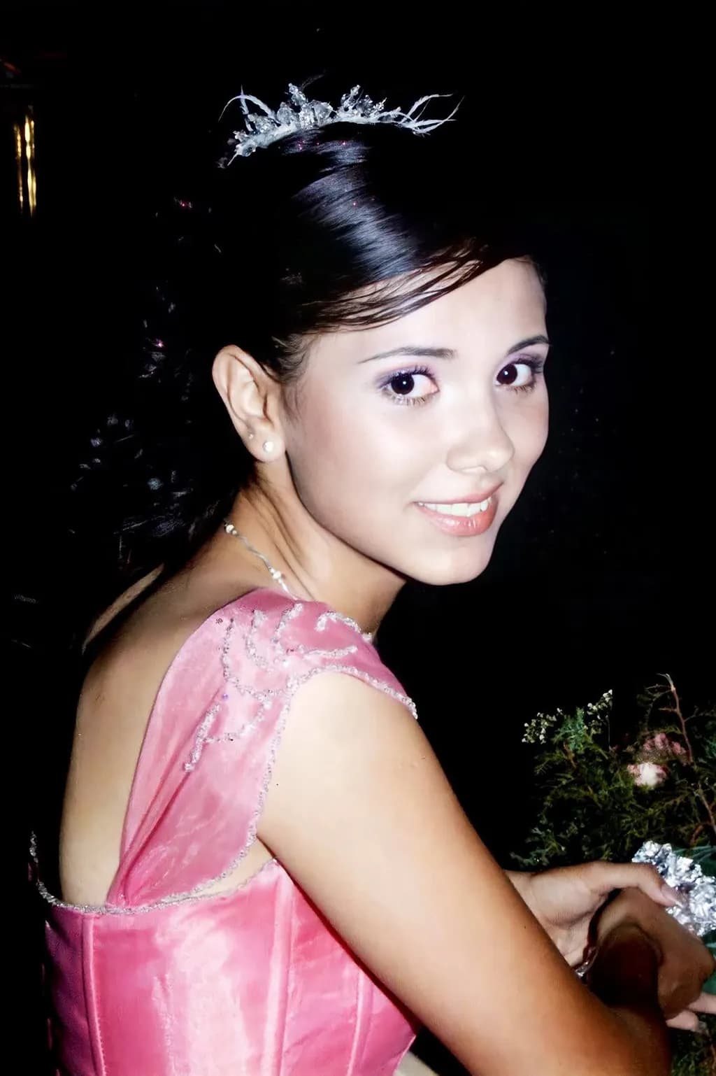 Radiant Elegance: A Portrait of Youthful Grace in Pink Attire